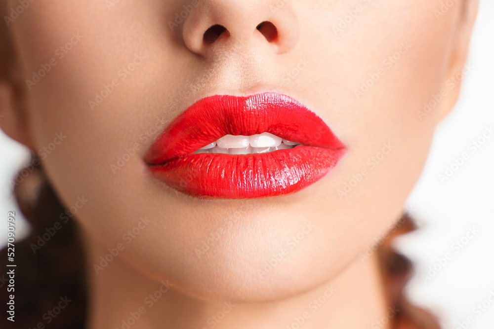 Fototapeta premium Close-up Beautiful lips. Sexy plump lips which red lipstick.