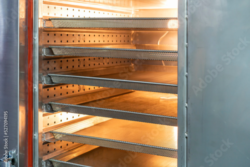 Empty stainless basket mesh in pastry oven for manufacture in food industrial