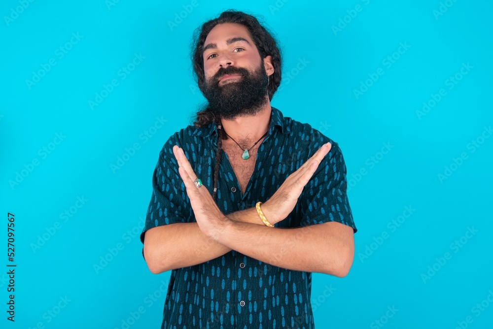 MODEL Has rejection angry expression on face and crossing hands doing refusal negative sign. MODEL Has rejection angry expression on face and crossing hands doing refusal negative sign.