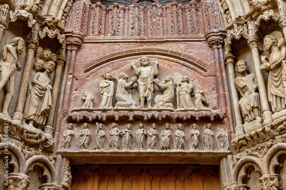 The tympanum of Christ redeemer (Cristo Redentor) in the principal facade of San Bartolome church in Logroño, La Rioja. Spain.
