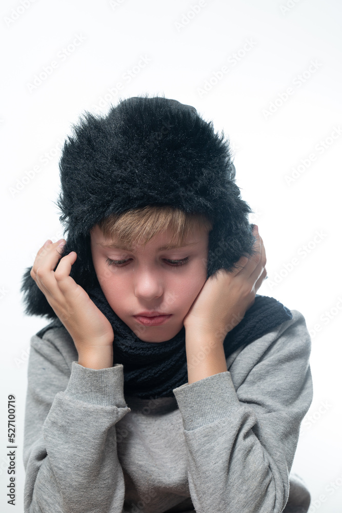 Portrait of upset guy in winter hat and scarf, cold winter and crisis time. Portrait of upset guy in winter hat and scarf, cold winter and crisis time.