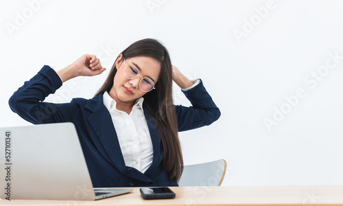 Asian businesswoman, attractive and young, stretching her shoulder and arm muscles. due to sitting and working for a long time, with white background, to business people and office syndrome concept.