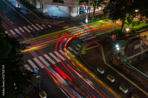 Car lights on crossroad in Okayama Japan photo