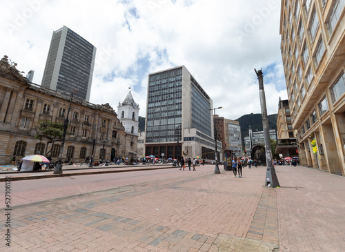 a landscape view of Jimenez avenue with 8th street corner, central bank and san francisco palace buildings at background at bogota, colombia downtown in sunny day