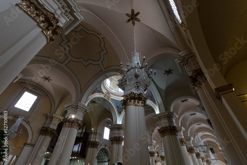 BOGOTA, COLOMBIA Beautiful antique chandelier with neoclassical architecture of primatial cathedral  photo