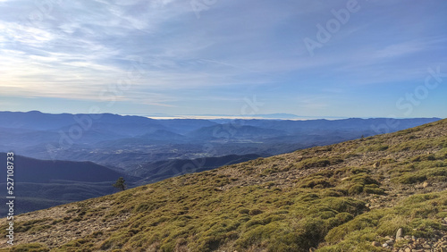 Landscape with green mountains and traditional towns