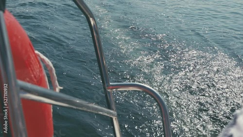 water outside the yacht. waves behind a sailing boat
