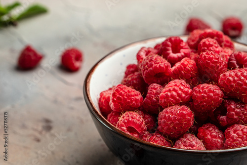 Fresh raspberries in bowl. Ripe juicy fresh raspberries. Organic raspberries, healthy food, vitamins, summer berry fruit. Long banner format. place for text