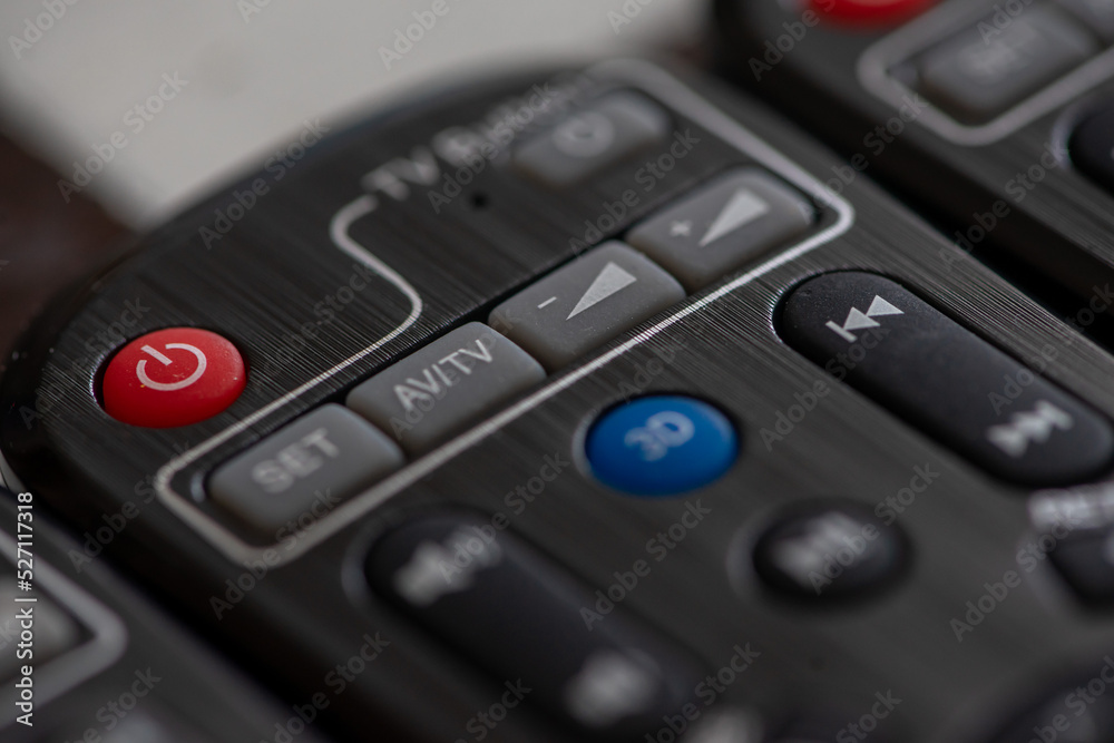 Close-up on a remote control sitting on a table Close-up on a remote control sitting on a table