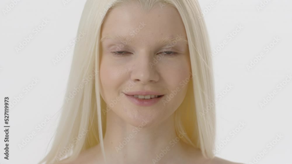 Beauty Woman face Portrait. Beautiful Spa model Girl with Perfect Fresh Clean Skin. Albino Female with Blonde hair looking at camera and smiling. Youth and Skin Care Concept. Isolated on a white Beauty Woman face Portrait. Beautiful Spa model Girl with Perfect Fresh Clean Skin. Albino Female with Blonde hair looking at camera and smiling. Youth and Skin Care Concept. Isolated on a white