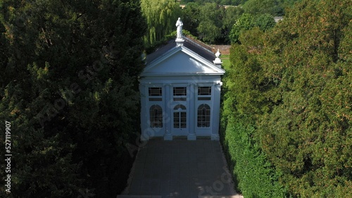 Photography Aerial top down view from the drone onto the narrow passageway leading to a small chapel