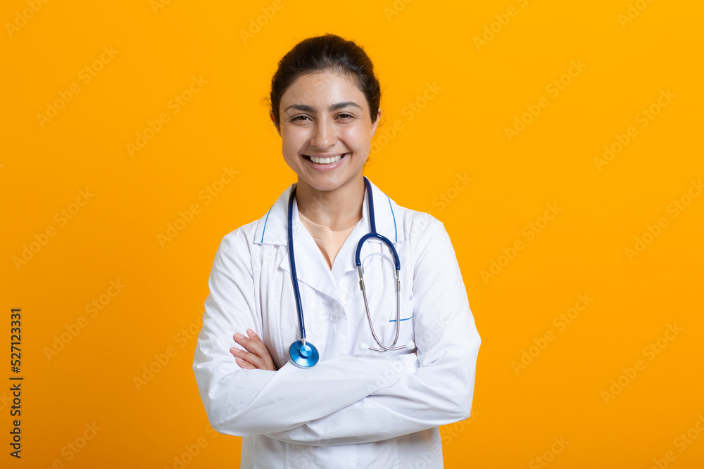 Portrait of indian doctor woman in white medical gown stethoscope isolated on yellow background. Portrait of indian doctor woman in white medical gown stethoscope isolated on yellow background.