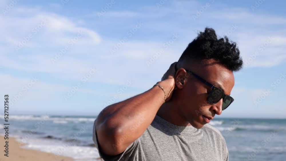 African American man enjoying a walk at the beach in Southern California. African American man enjoying a walk at the beach in Southern California.