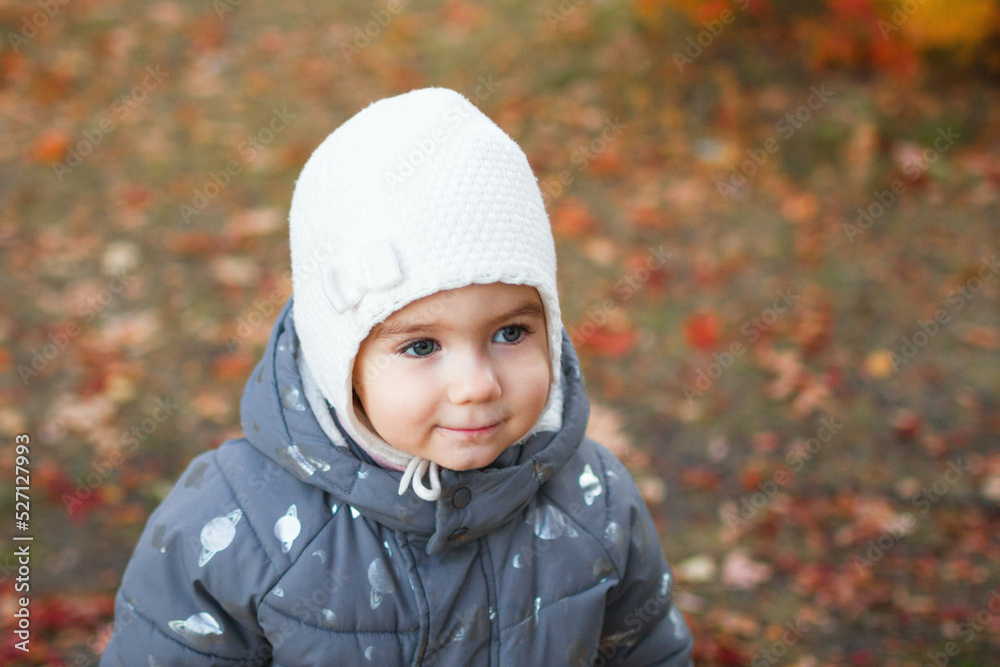 Portrait of cute smiling little baby girl on autumn orange background. Portrait of cute smiling little baby girl on autumn orange background.