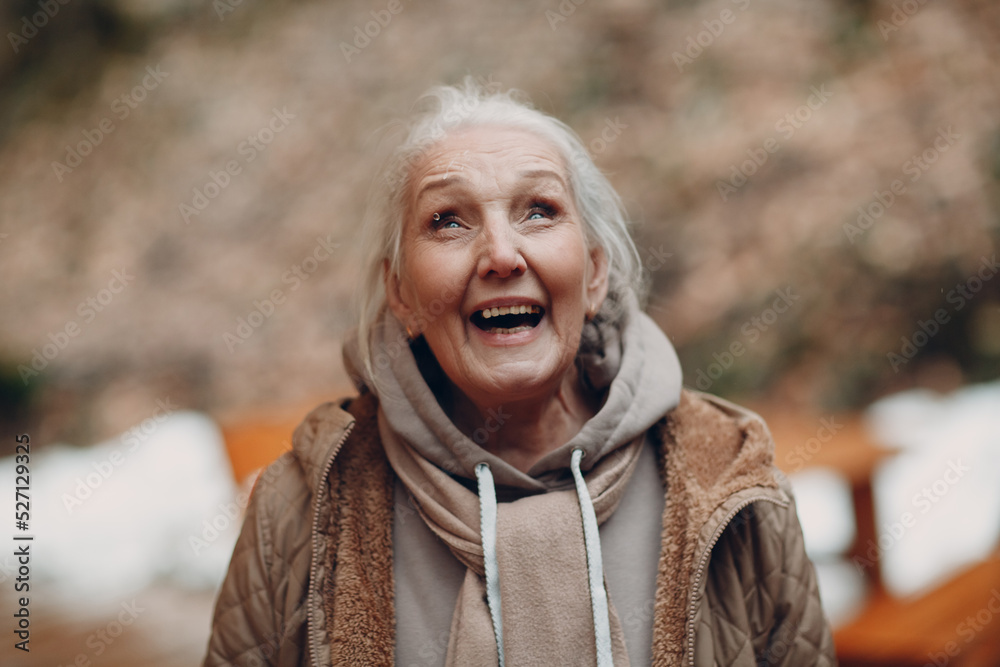 Portrait of smiling gray haired elderly woman outdoor Portrait of smiling gray haired elderly woman outdoor