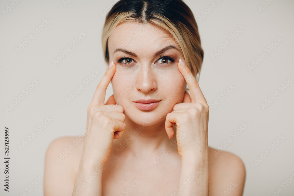 Young adult doing facial gymnastics self massage and rejuvenating exercises face building and lifting Young adult doing facial gymnastics self massage and rejuvenating exercises face building and lifting