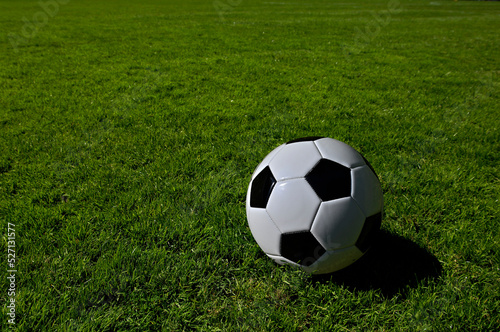 A traditional soccer ball lies on the pitch prior to a game