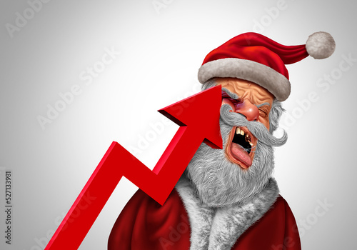 Christmas Inflation pain concept as Santa Claus being hit hard by an upward leaning financial chart arrow and consumer prices and the painful expensive Holiday season photo