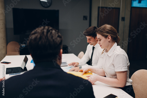 Businessman and businesswoman team at office meeting. Business people group conference discussion sit at table with boss man and woman