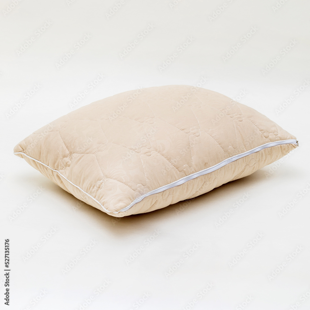 beige sleeping pillow isolated on white background beige sleeping pillow isolated on white background