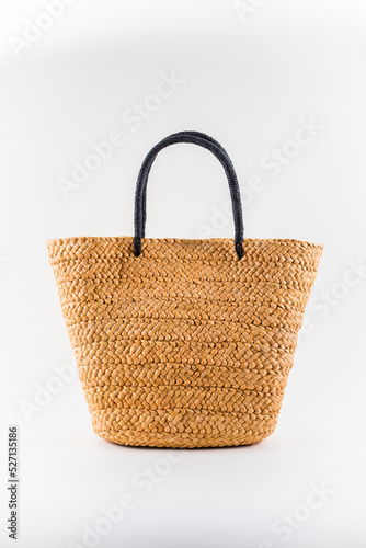 female summer straw bag isolated on white background
