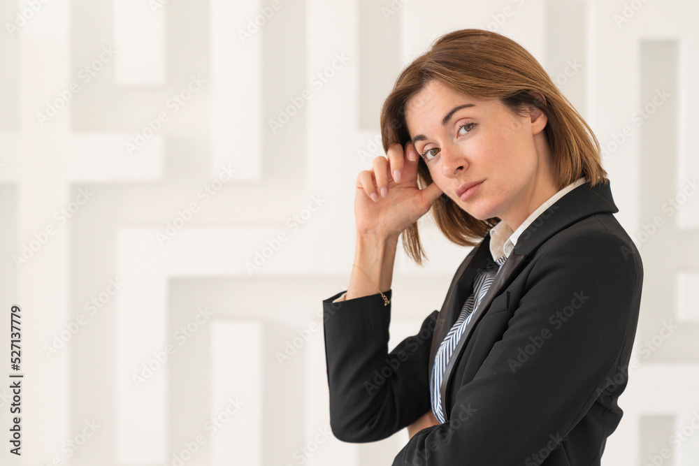 Close up portrait of thoughtful and attractive businesswoman on white textured background Close up portrait of thoughtful and attractive businesswoman on white textured background