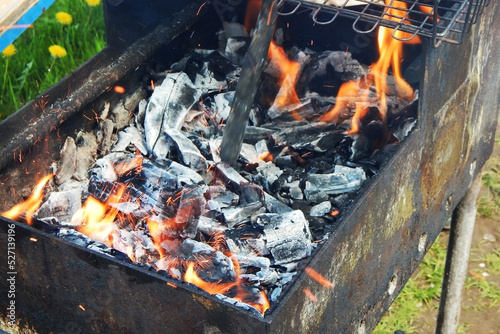 Fire and coals in the barbecue grill