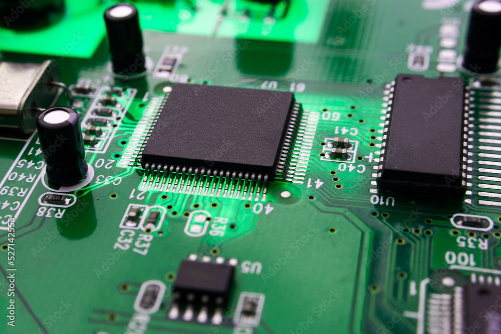 macro photography of integrated modern circuit on printed circuit board. macro photography of integrated modern circuit on printed circuit board.