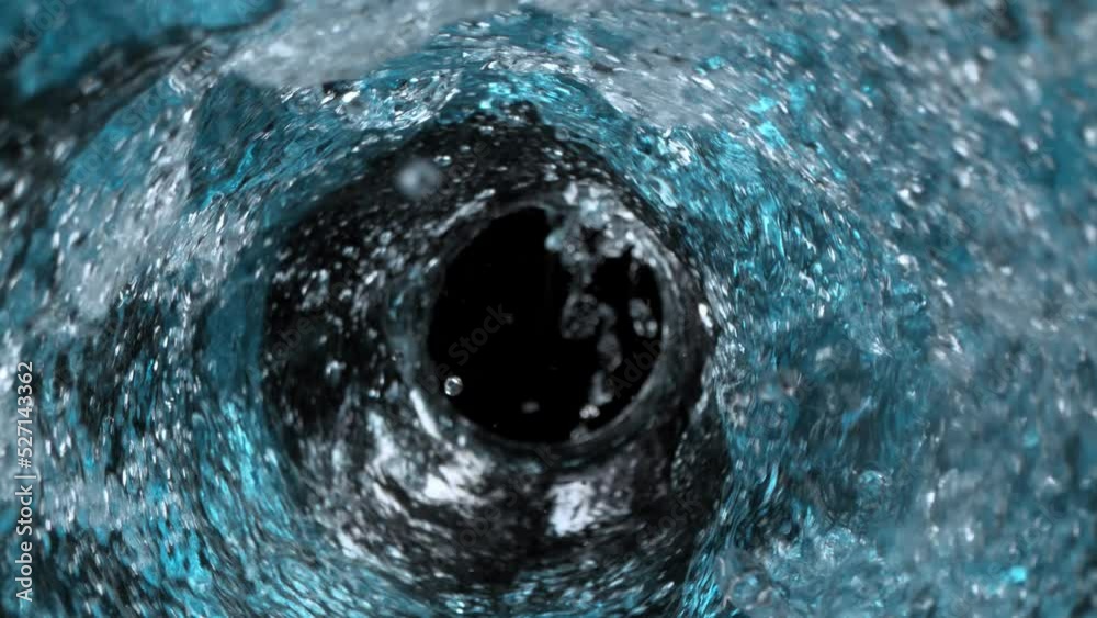 Super Slow Motion Shot of Water Vortex Splash Isolated on Light Blue Background at 1000fps.
