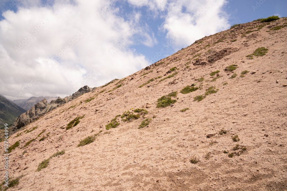 Hiking in the mountain. View of the rocky mountaintop in a sunny day.