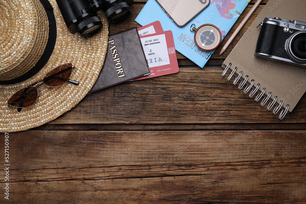 Flat lay composition with passport and tickets on wooden table. Space for text Flat lay composition with passport and tickets on wooden table. Space for text