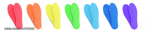 Set with colorful orthopedic insoles on white background, top view. Banner design