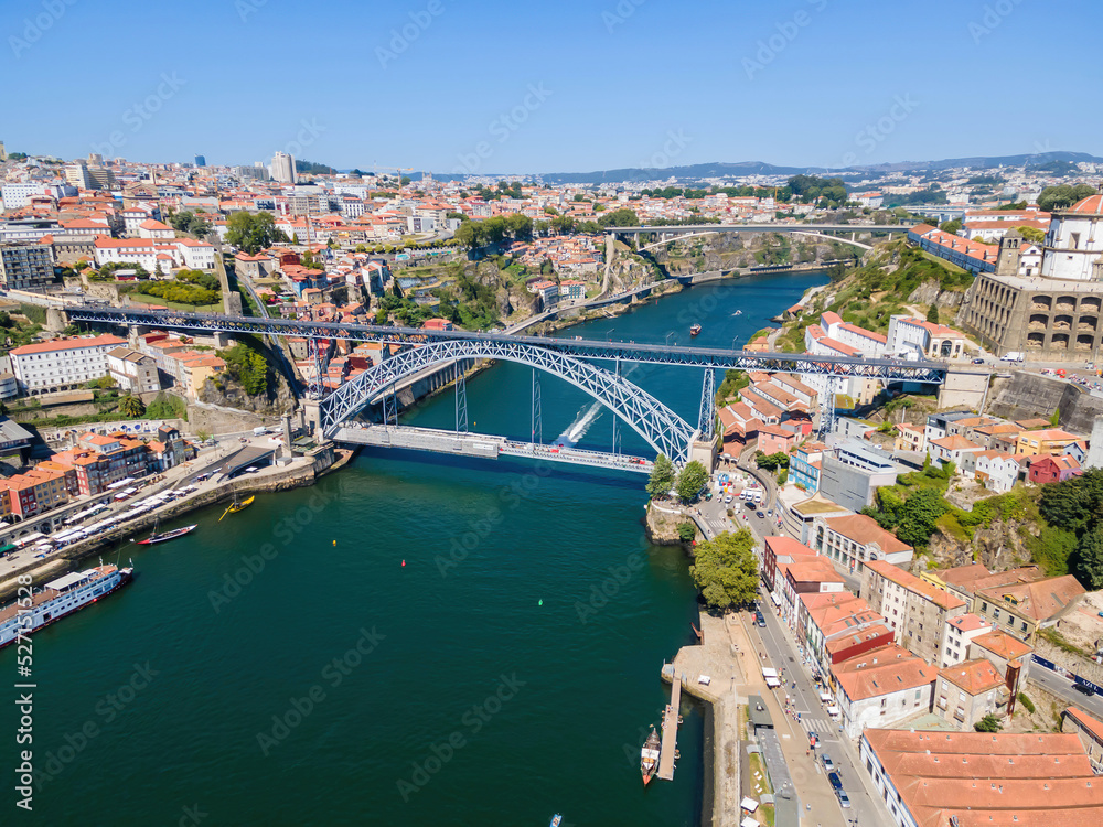 An aerial view of the Douro River and Luis I Bridge in Porto