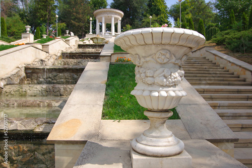 Moldova. Kishinev. 08.29.2022. white plaster vase on the street in the city park. photo