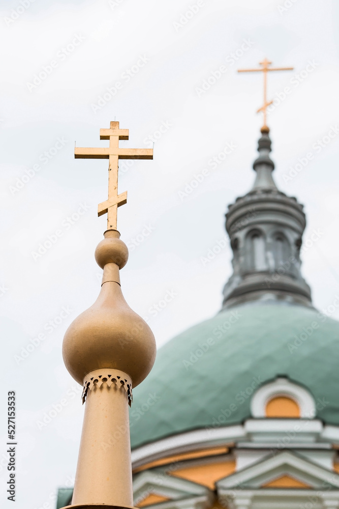 The territory of the Zaraisk Kremlin. Orthodox Cathedral of the Beheading of John the Baptist in the Zaraisk Kremlin, Russia. Orthodox cross and domes close-up. The territory of the Zaraisk Kremlin. Orthodox Cathedral of the Beheading of John the Baptist in the Zaraisk Kremlin, Russia. Orthodox cross and domes close-up.