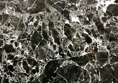 Photo of natural black marble with abstract pattern