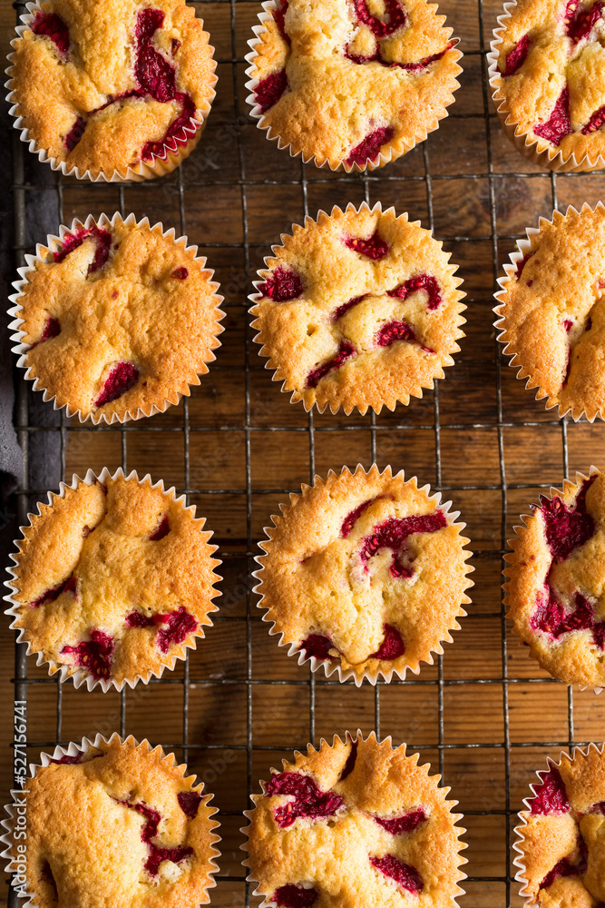 Raspberry muffins on wire rack Raspberry muffins on wire rack