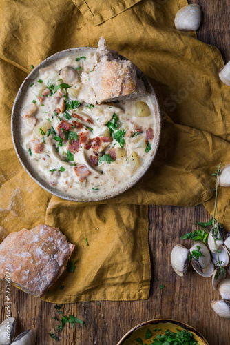 Clam chowder in a bowl with crusty bread photo