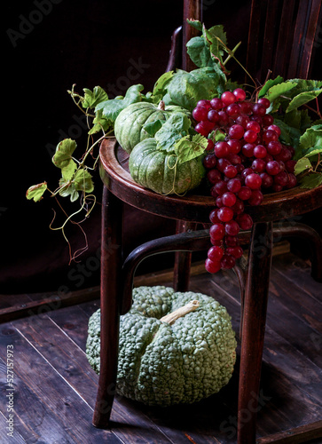autumn composition with wine and green pumpkins and grapes. Concept of Thanksgiving photo