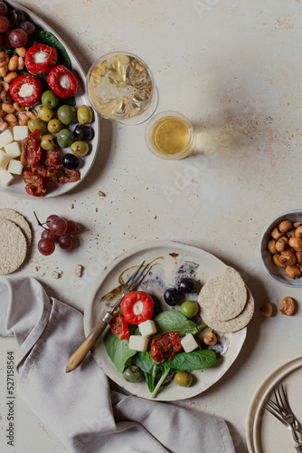 Antipasti platter with oatcakes and white wine photo