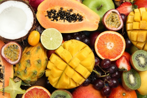 Fototapeta Naklejka Na Ścianę i Meble -  Many different delicious exotic fruits as background, top view