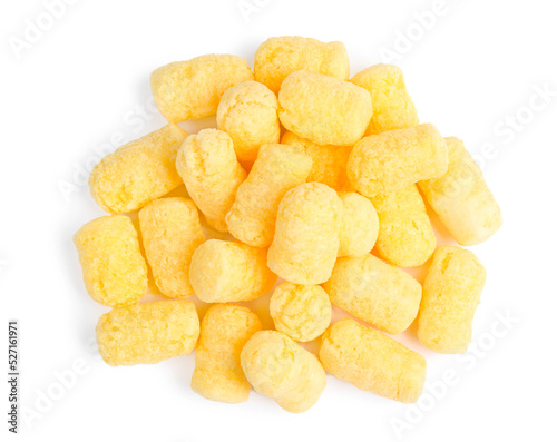 Pile of tasty corn puffs on white background, top view