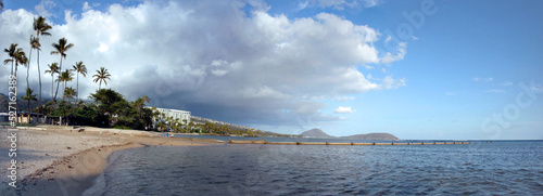 Wall runs into the water at Kahala Beach photo