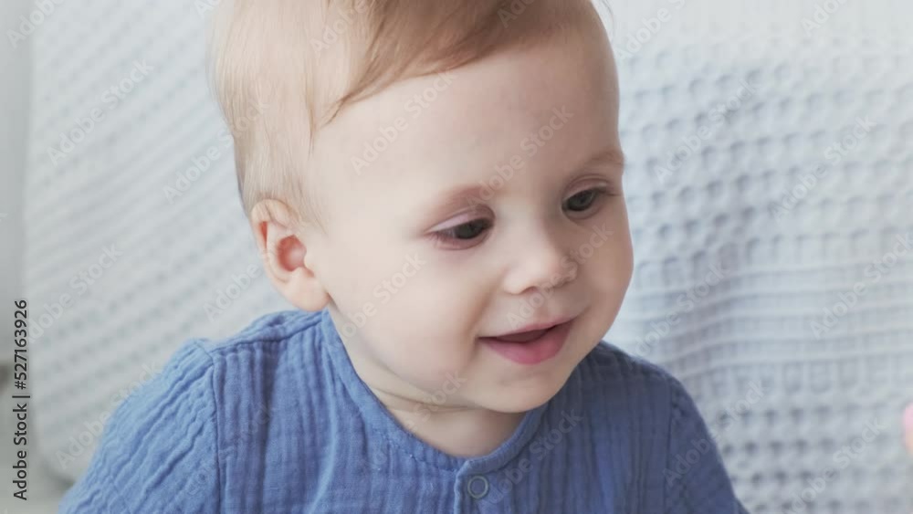 Close-up of a laughing little child. Children's products. Happy loving family
Close-up of a laughing little child. Children's products. Happy loving family