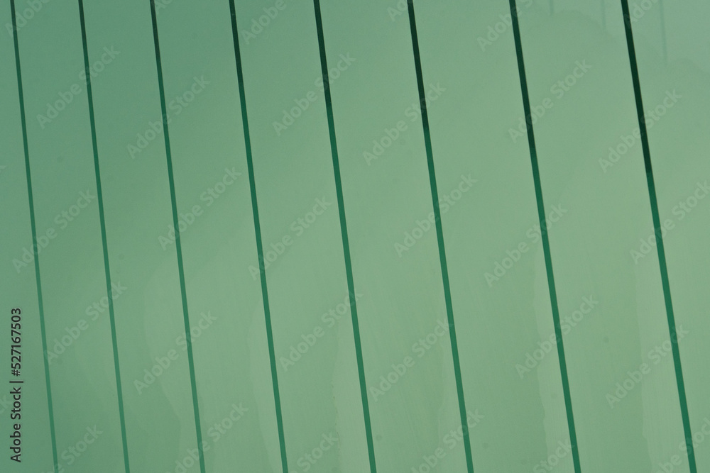 Obraz premium Green glass panes stacked forming a pattern