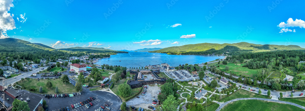 Fototapeta premium Panoramic aerial view of Lake George New York popular summer vacation destination with colonial wooden fort William Henry