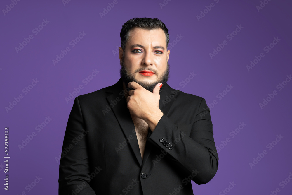 non binary person in studio on an isolated background purple velvet looking straight ahead non binary person in studio on an isolated background purple velvet looking straight ahead
