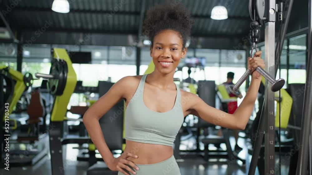 Portrait of African sport girl in sportwear exercising in fitness club
