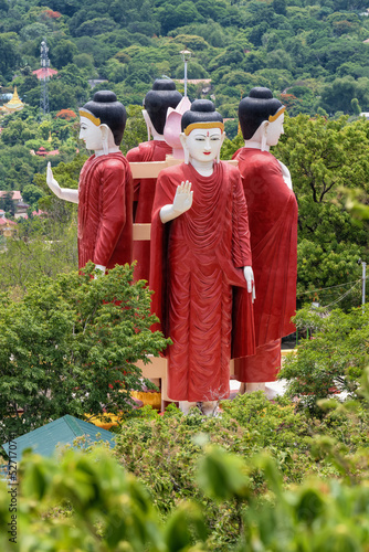 four standing buddha statue at Shwe Thar Lyaung Mountain Pagoda, Kyaukse, Mandalay, Myanmar photo
