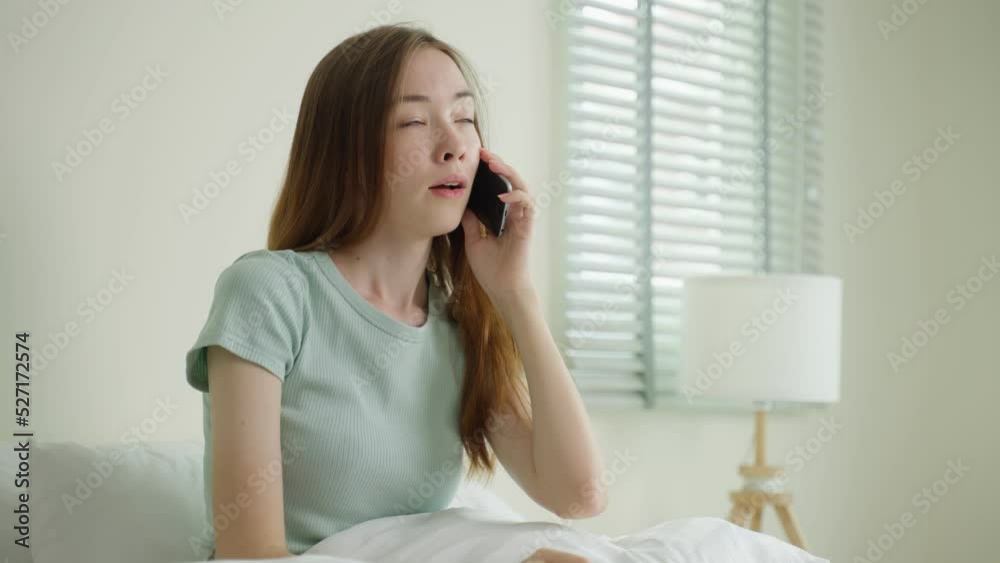 Young Caucasian woman use mobile phone call on bed at home in morning. Young Caucasian woman use mobile phone call on bed at home in morning.